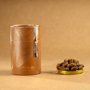 Brown cylindrical container of Bruijn Chimichurri Pistachios with minimalist design, containing pistachios coated in herb-rich chimichurri seasoning.