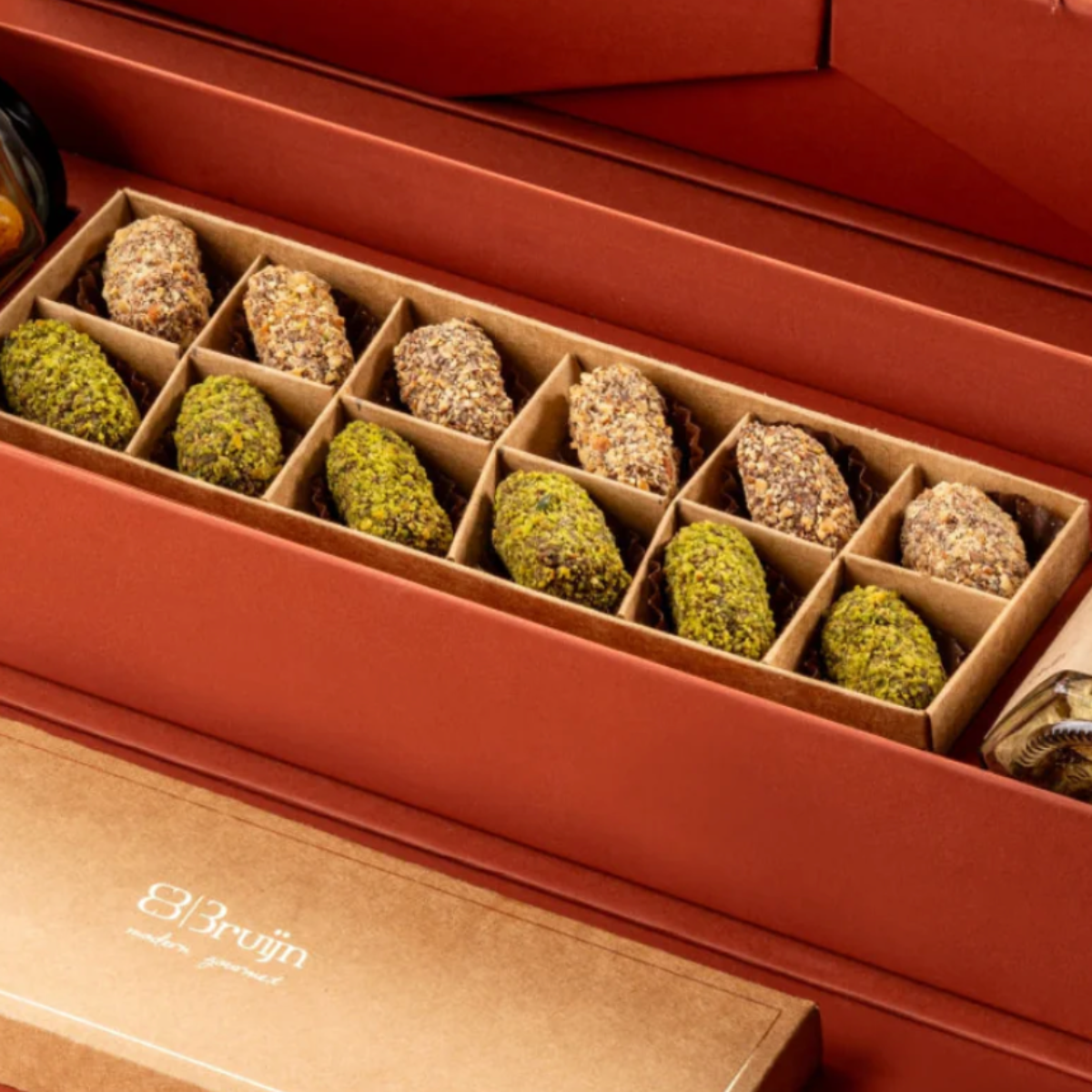 12pc~ Date truffles signature mouth melting date truffles encrusted with diced nuts flavored with saffron, & cardamom and cinnamon & orange blossom water.