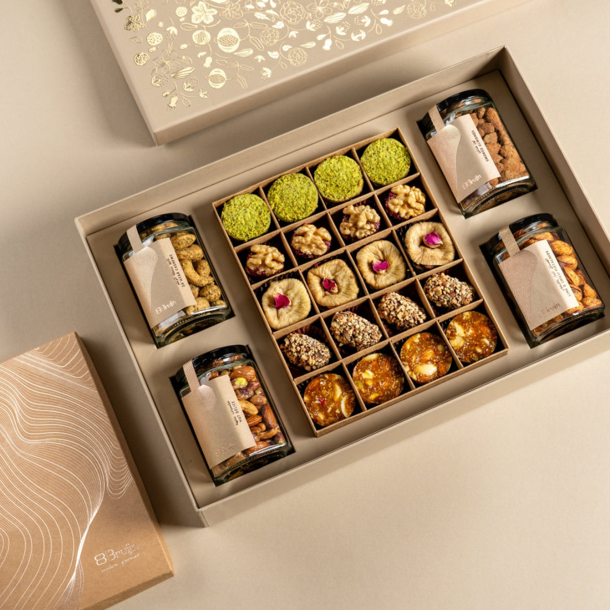 Exquisite box with Za’atar Cashew, Smoked almonds, Lime and chilli pistachios, Salted Caramel and Nut Delice, Ranginaik, Walnut and Dried fruit wholes, Saffron pistachio and rose figs, Date truffles and Fig and Nut Bites