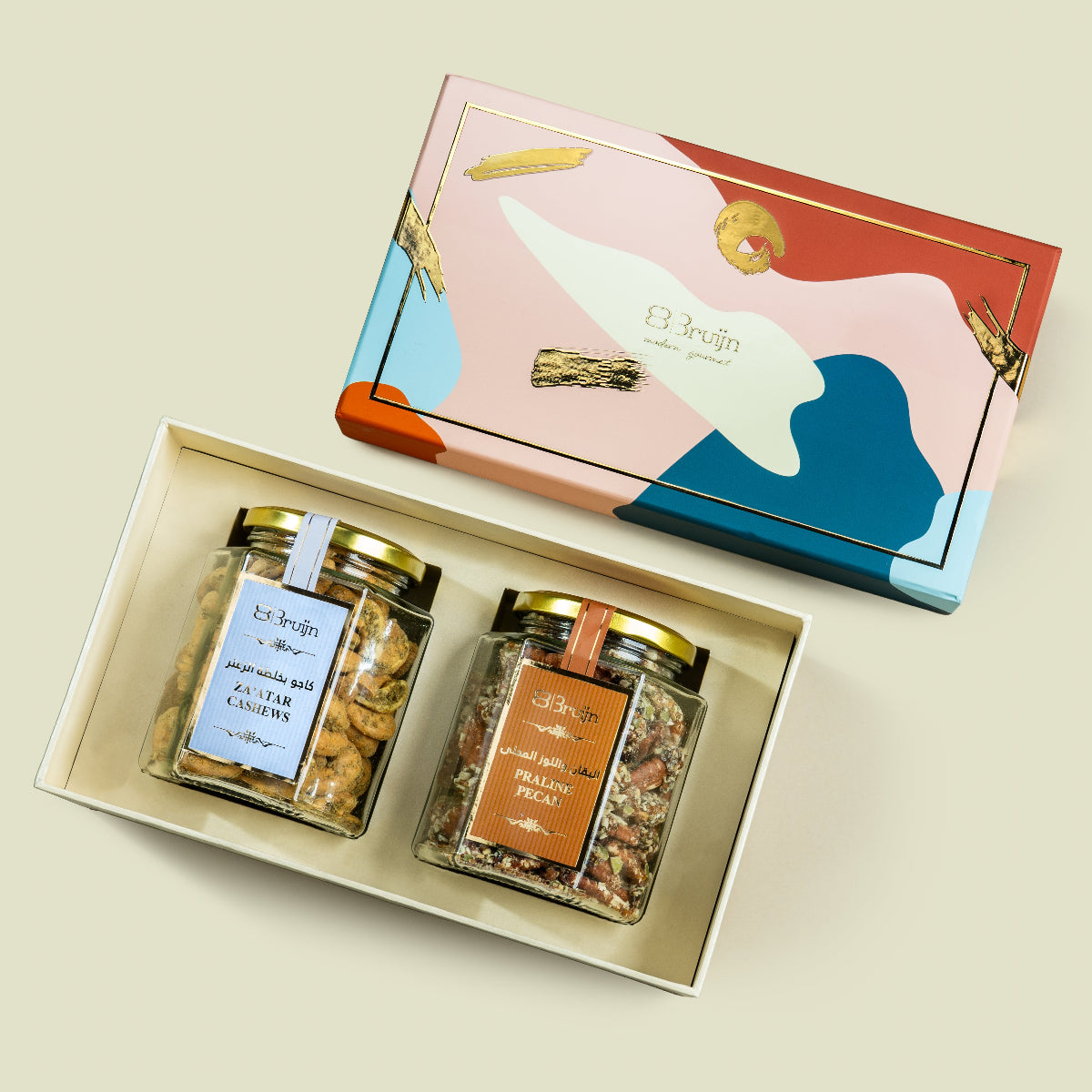 Open tower gift set showing Za’atar cashews, praline pecans, and opulent box of figs and stuffed dates.