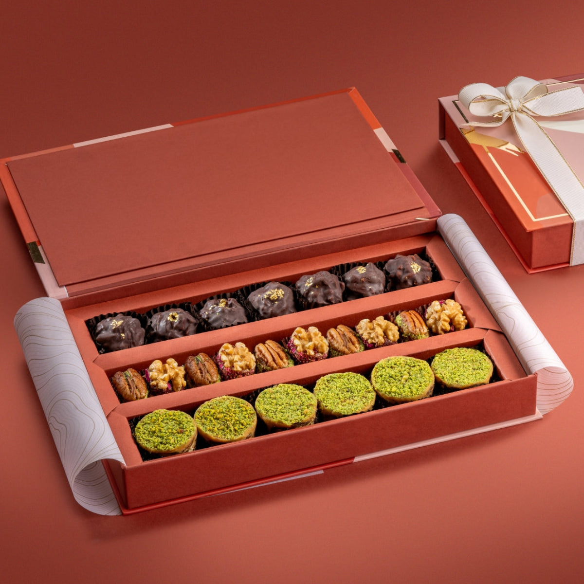 Regal box showing almond rocks, pecan & date wholes, walnut & dried fruit wholes, and ranginak.