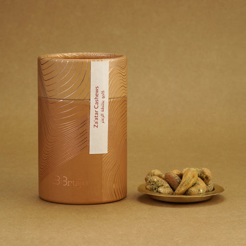 Savoury Indian cashews coated with aromatic Za’atar spices in a sustainably packed cylindrical jar.