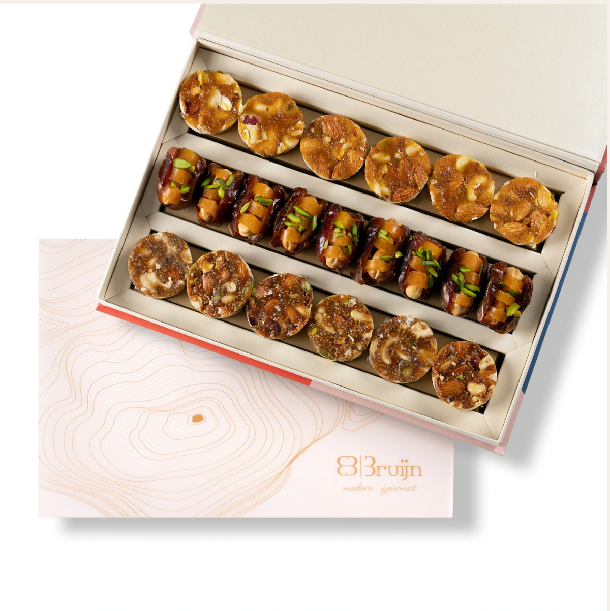 Regal box from tower gift set with fig apricot bites and mejdool dates stuffed with cashews and dried mango.